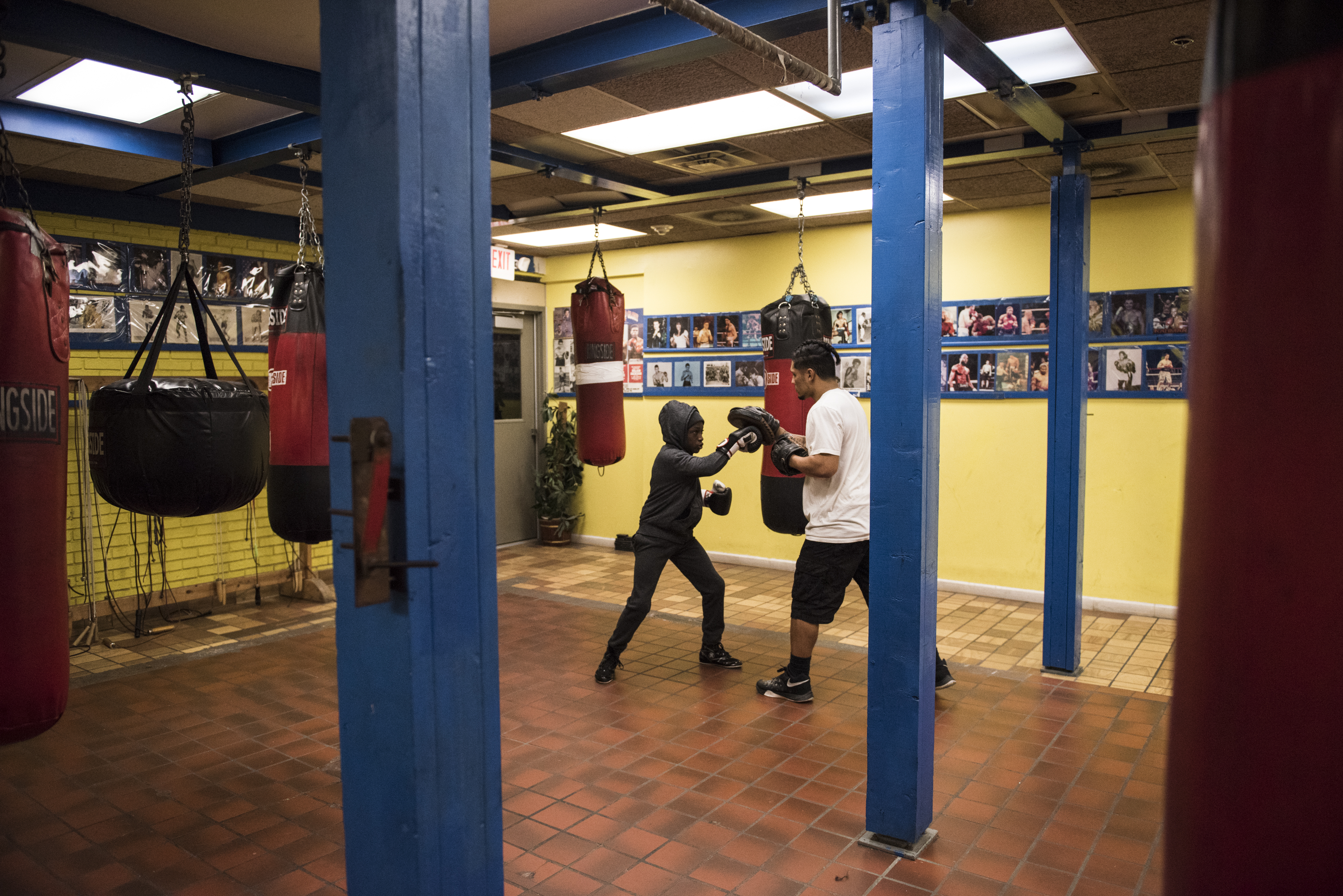 Lungz practices the mitts with professional Syracuse boxer Luis Vargas.