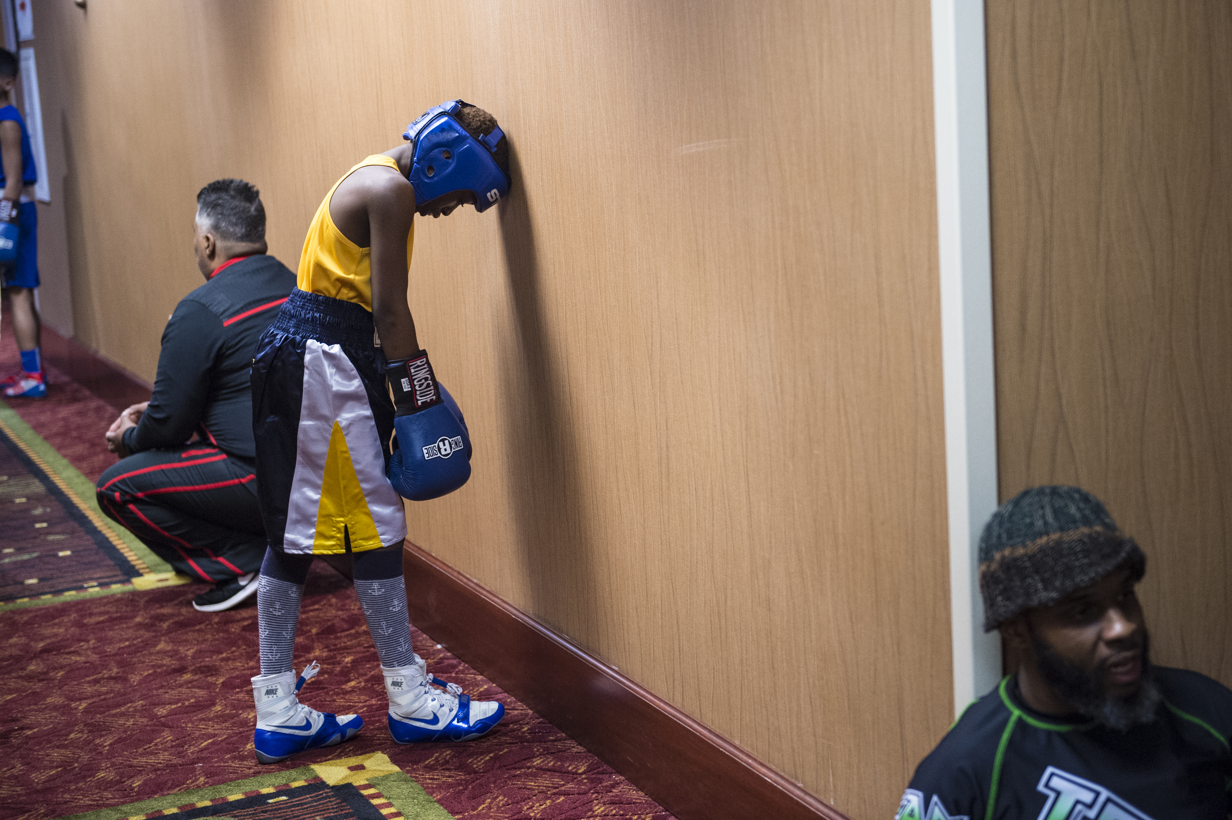 Lungz waits in the hallway for his championship match to be called to the ring.