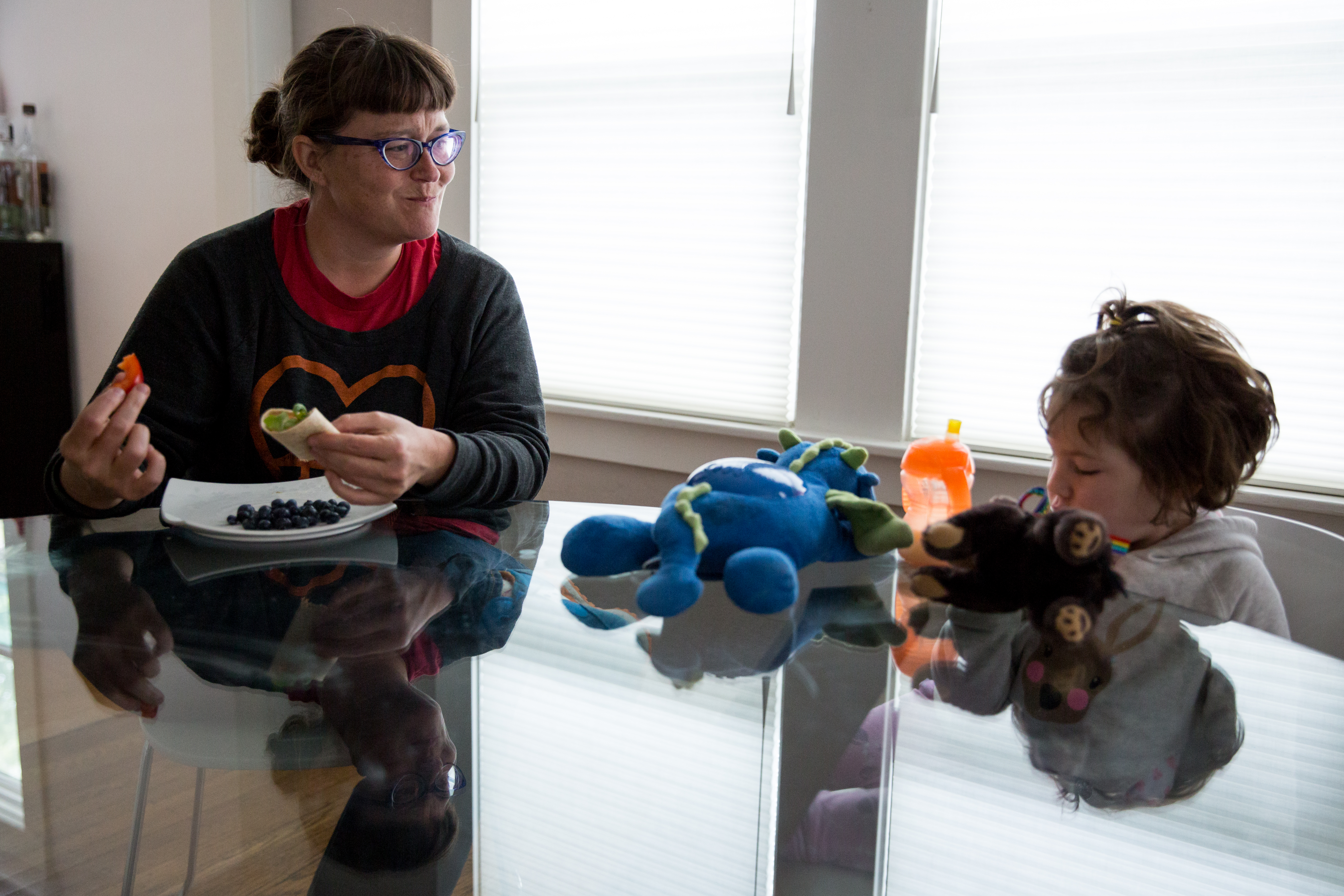 (A) Lola watches Etta with amusement as she talks about whatever comes to mind.